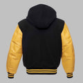 Black and yellow varsity jacket with a hood on a gray background
