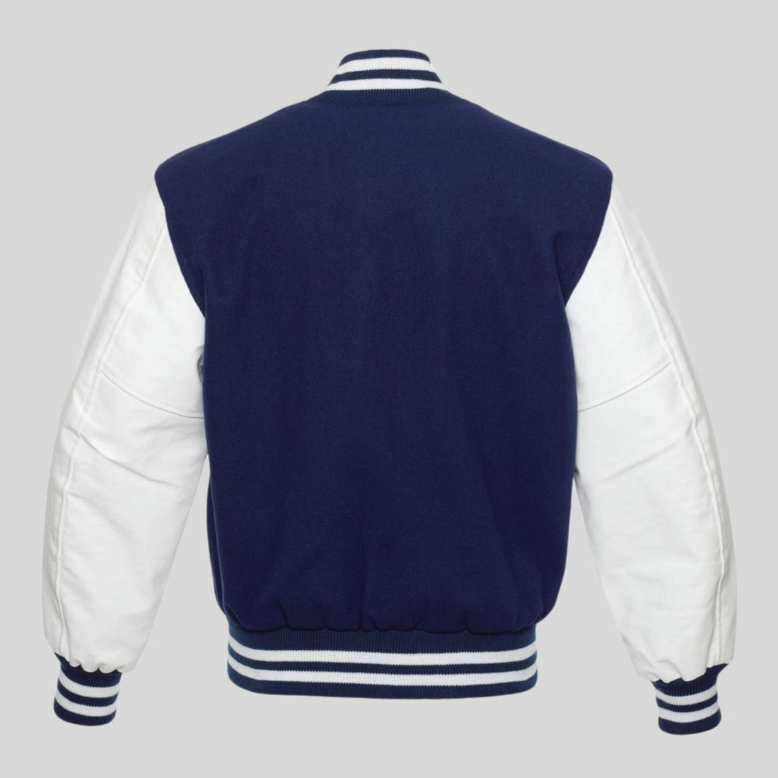 Navy blue wool varsity jacket with white vinyl sleeves, striped rib-knit trim at the collar, cuffs, and waistband, and a traditional snap button front.