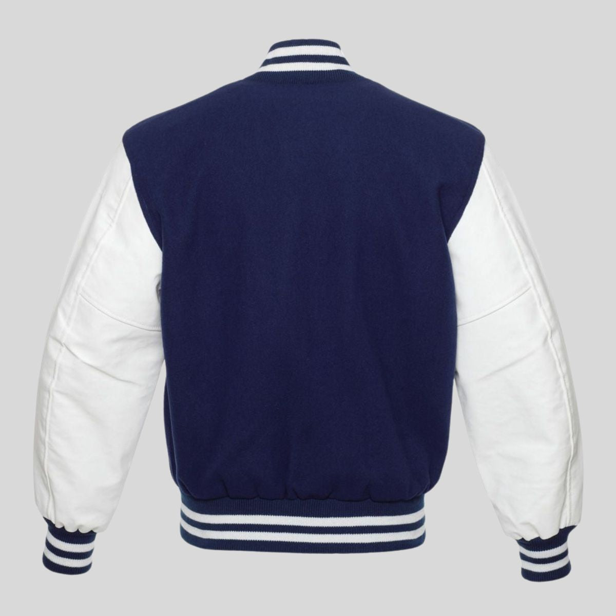 Navy blue varsity jacket with white sleeves on a gray background