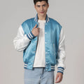 Trendy blue satin varsity jacket with white sleeves and trim, perfect for a fashionable athletic look