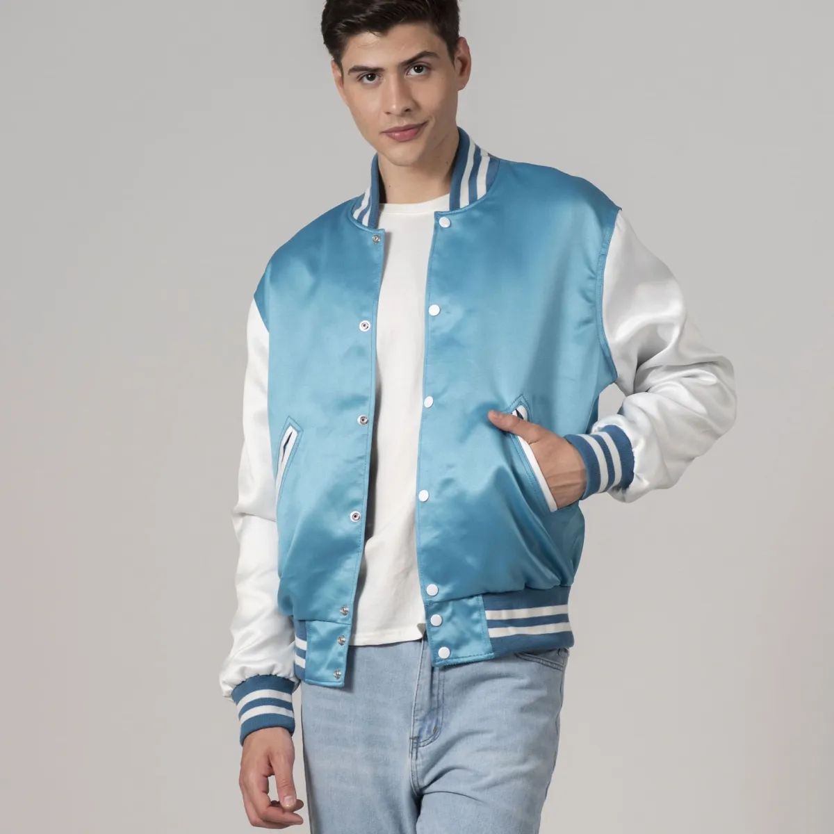 Men's modern blue varsity jacket in satin with contrasting white sleeves and trim, ideal for casual wear