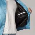 Stylish blue satin varsity jacket featuring white sleeves and trim, combining elegance and sporty flair