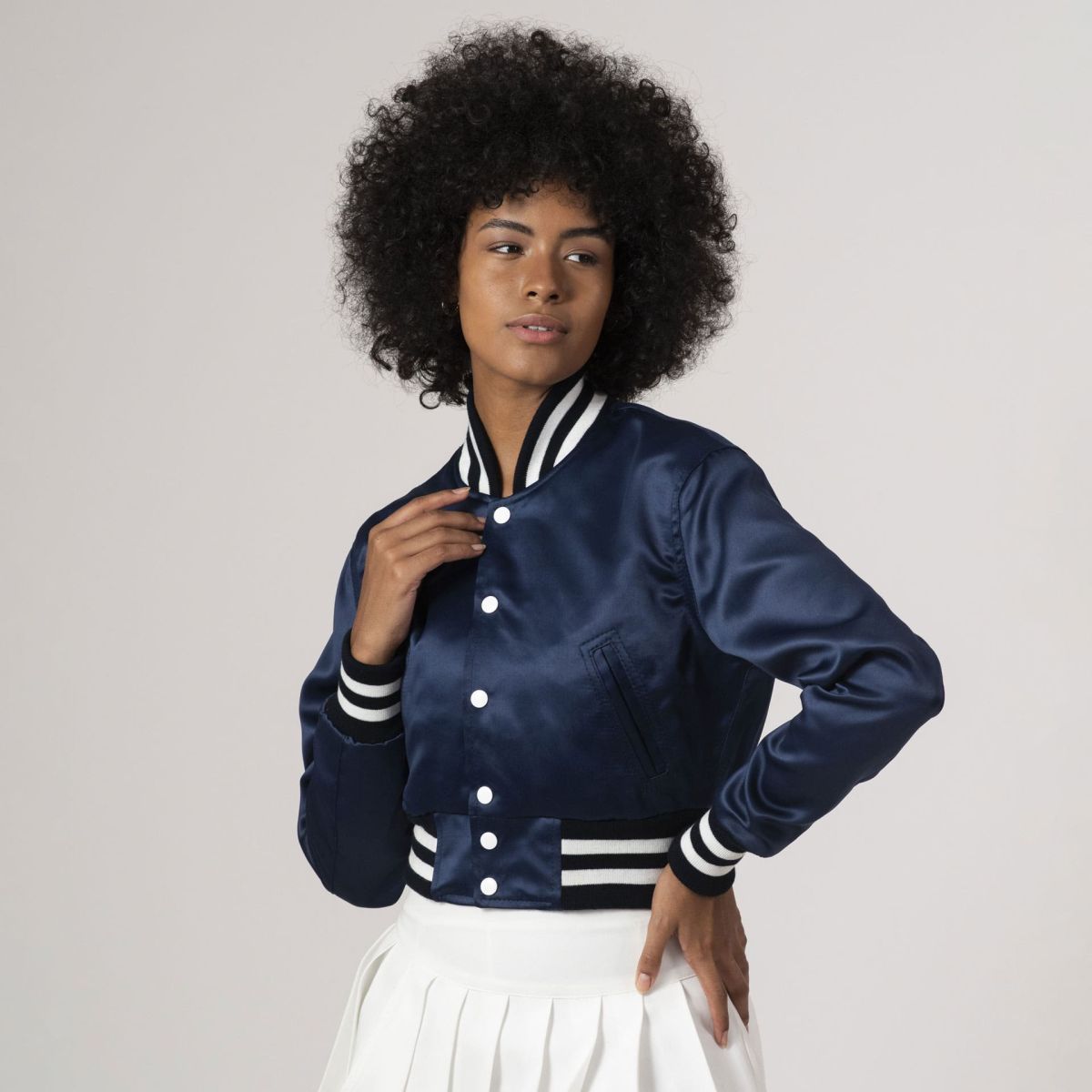 Navy blue satin crop top varsity jacket with a stylish and modern silhouette, perfect for casual outfits