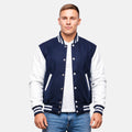 Man wearing a navy and white varsity jacket on a plain background