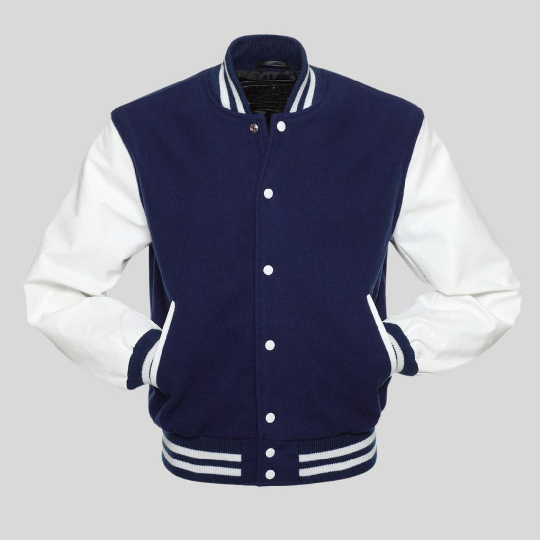 Navy blue wool varsity jacket with white vinyl sleeves, striped rib-knit trim at the collar, cuffs, and waistband, and a traditional snap button front.