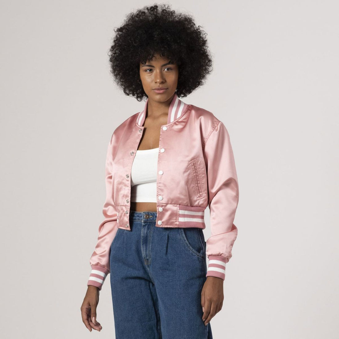 Pink satin crop top varsity jacket featuring a stylish design, perfect for a chic, sporty look