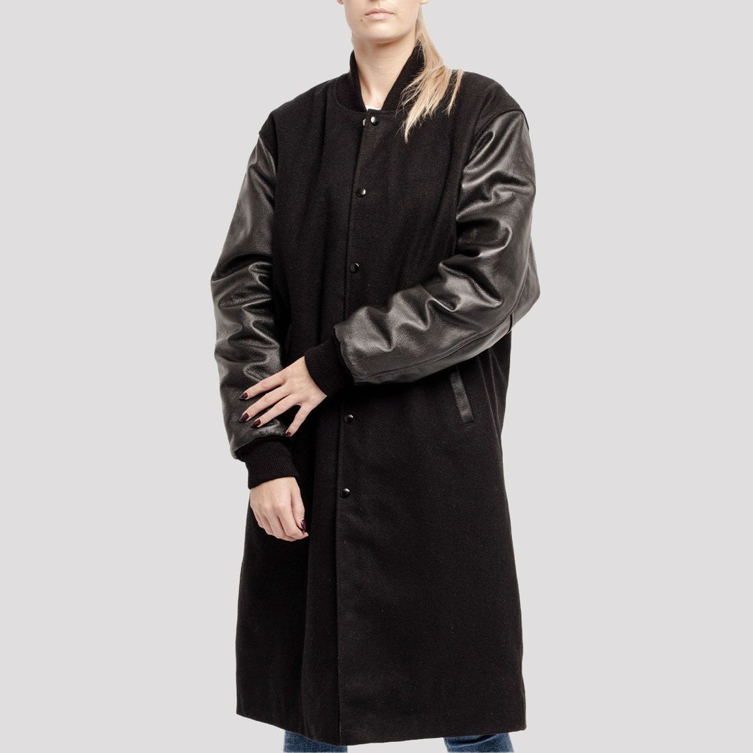 Premium black wool varsity coat with leather sleeves, combining classic style with modern sophistication