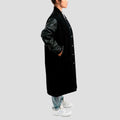 Chic premium black wool varsity coat with leather sleeves, designed for comfort and timeless fashion