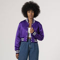 Chic purple crop top varsity jacket in satin, combining elegance with a sporty vibe.