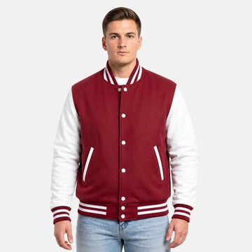 Man wearing a red and white varsity jacket on a white background
