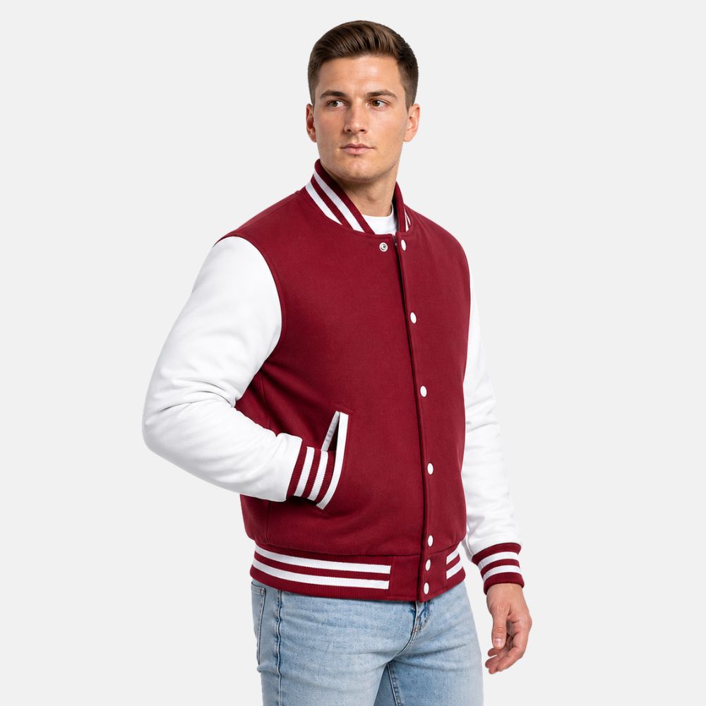 Man wearing a red and white varsity jacket on a white background