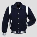 Retro navy blue wool varsity jacket with white leather trim, snap button front, striped rib cuffs, and vintage letterman style for men.