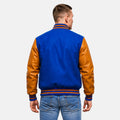 Man wearing a blue and brown varsity jacket on a white background