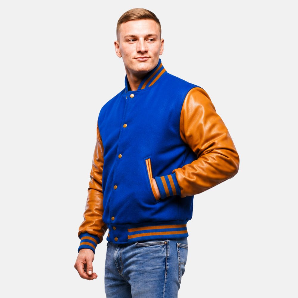 Man wearing a blue and brown varsity jacket on a white background