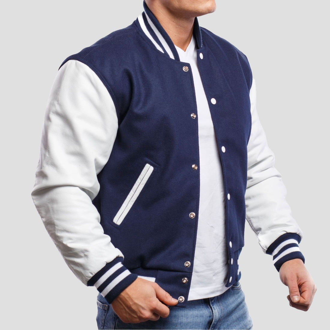 Royal blue wool letterman jacket with white leather sleeves, offering a classic and stylish varsity look.