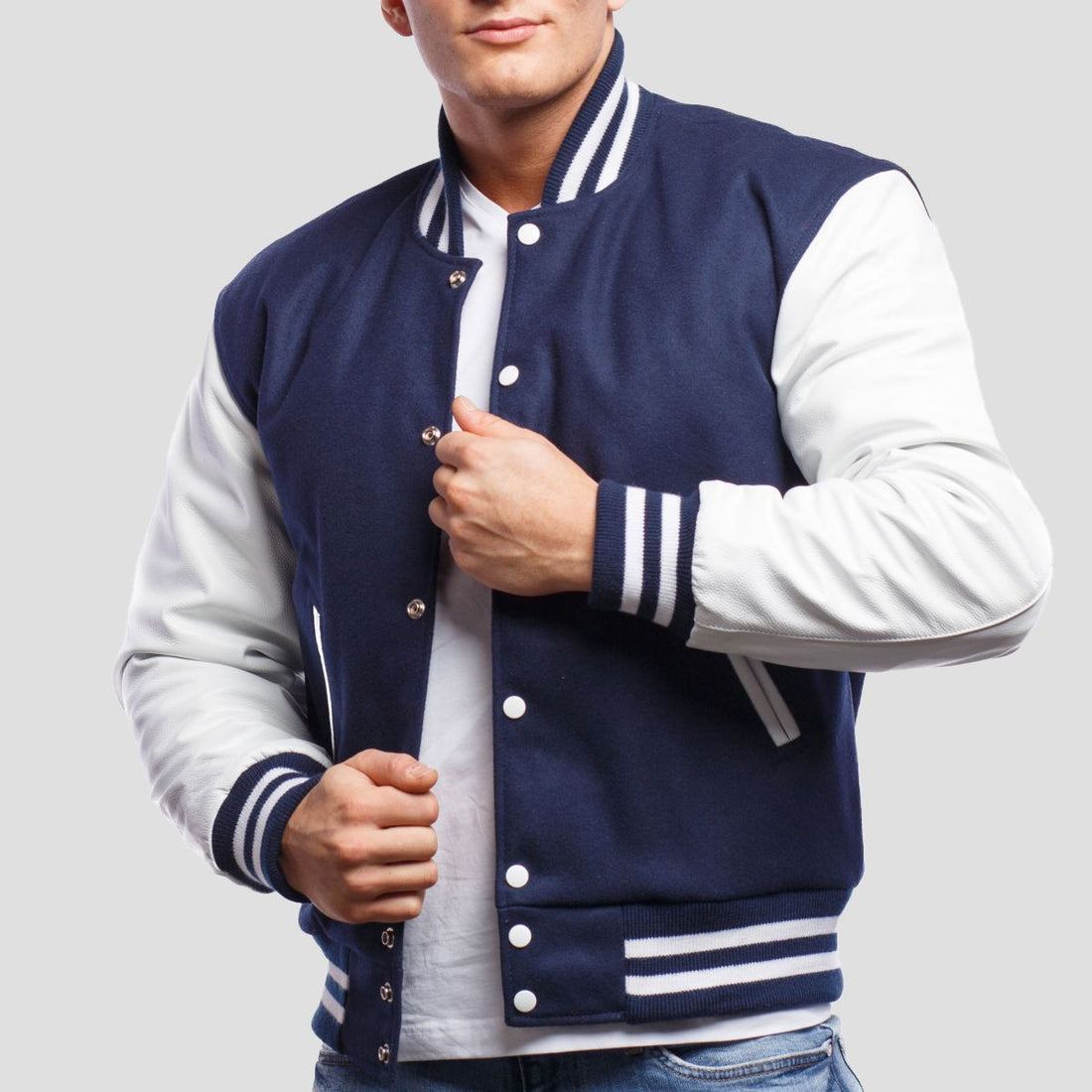 Royal blue wool letterman jacket with white leather sleeves, offering a classic and stylish varsity look.