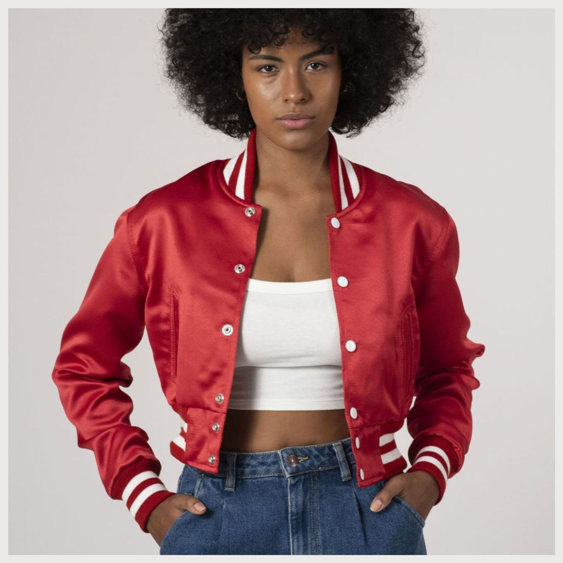 Scarlet red satin crop top varsity jacket featuring a sleek design, perfect for a stylish and sporty look