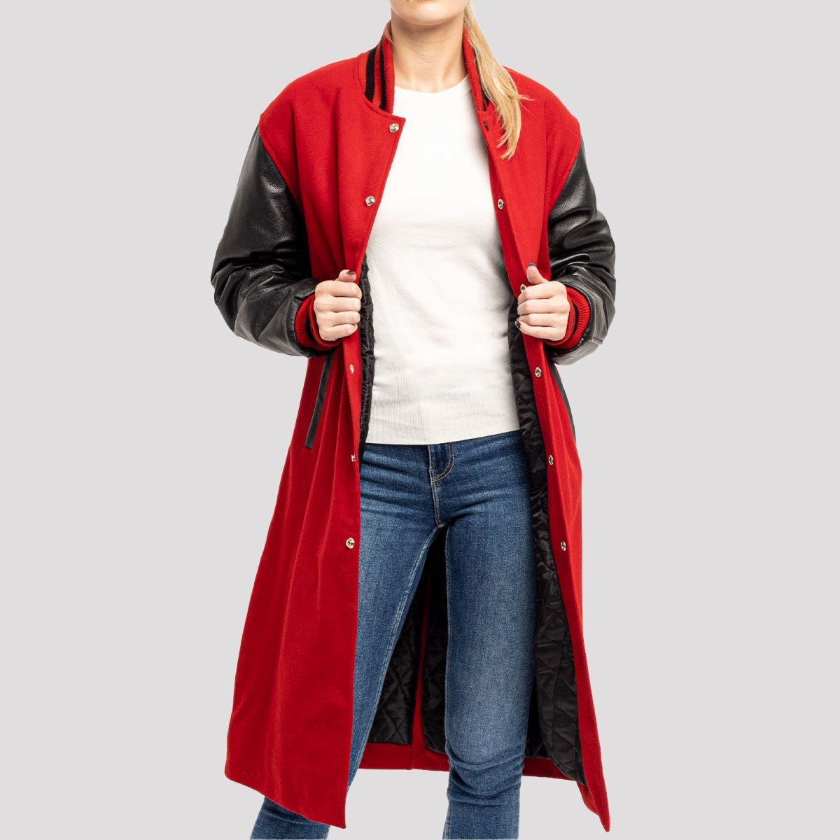 Scarlet red wool varsity letterman coat with black leather sleeves, combining classic style and modern sophistication