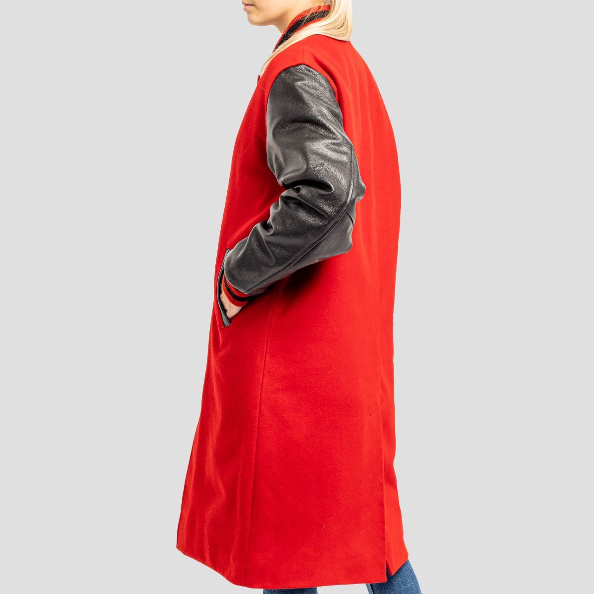 Stylish scarlet red varsity letterman coat with black leather accents, ideal for a fashionable and sporty appearance